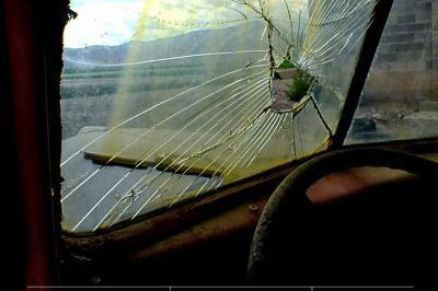 Cutting the Wire book cover images shows shattered car window