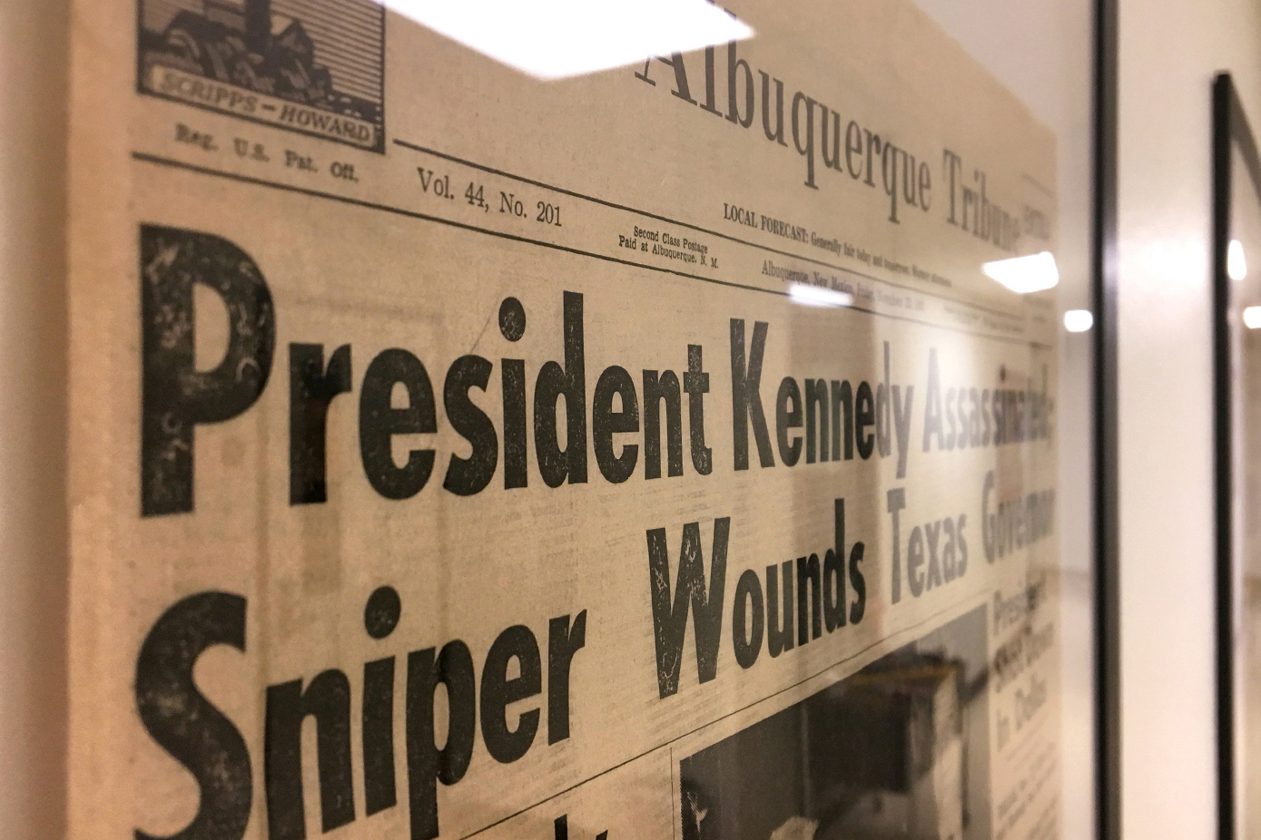 Photo of newspaper page front that shows Kennedy headline